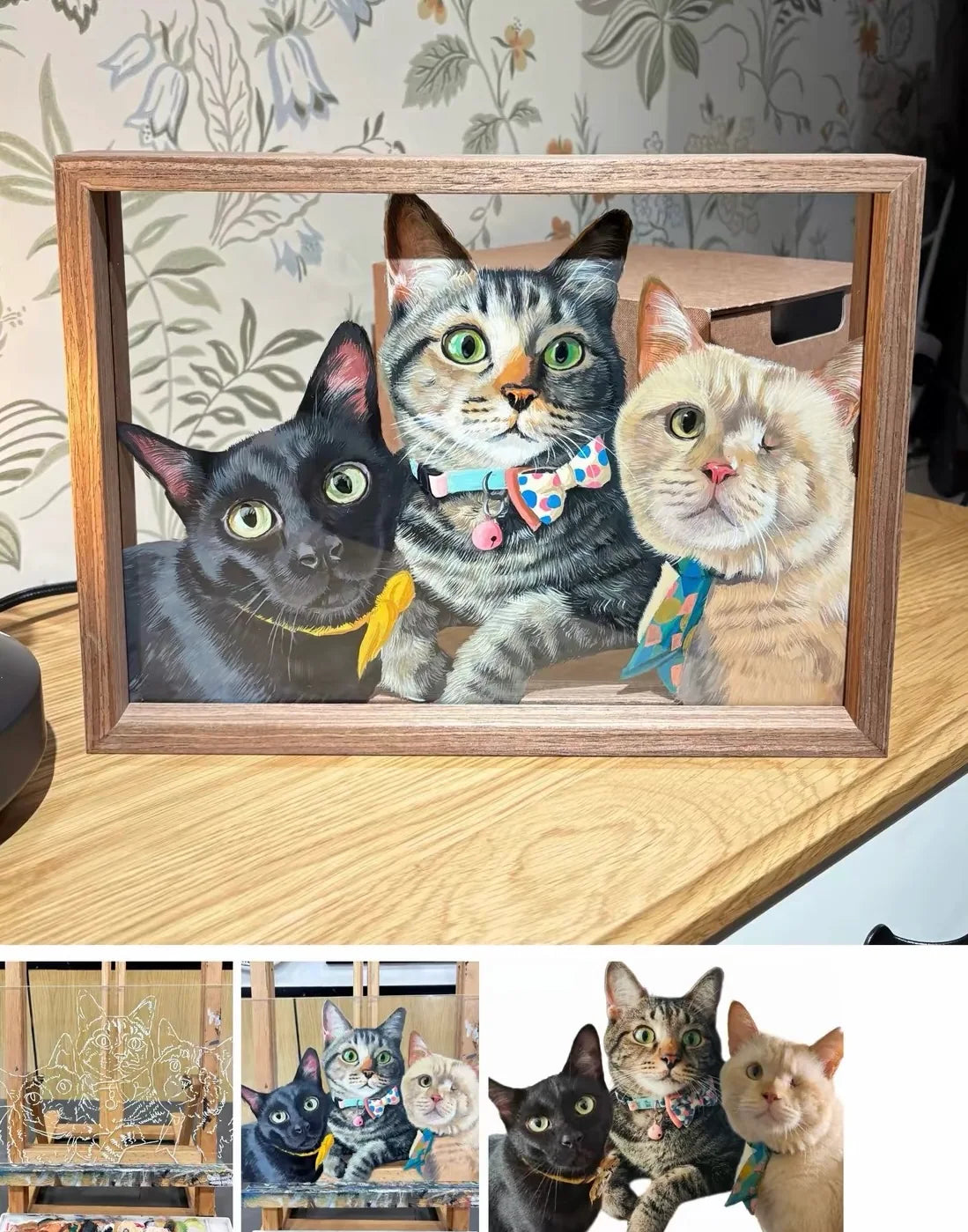 A black cat, a tabby and a cream cat together in one wooden frame.