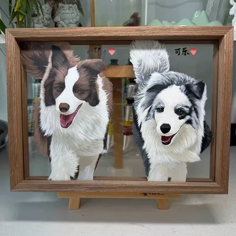 Two black-and-white collies painted together in a landscape frame.