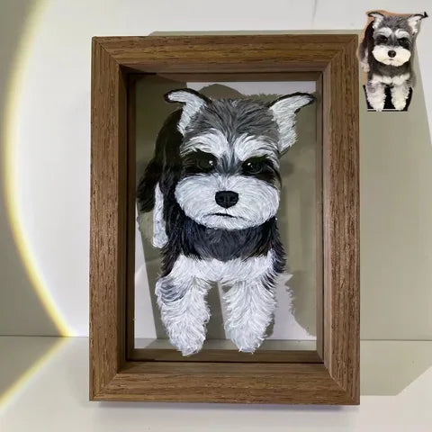 A dark schnauzer portrait in a tall wooden frame.