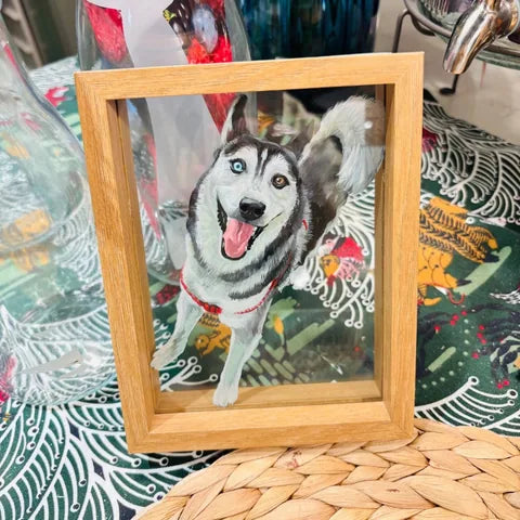 Husky frame on arranged woven table among decorative objects.