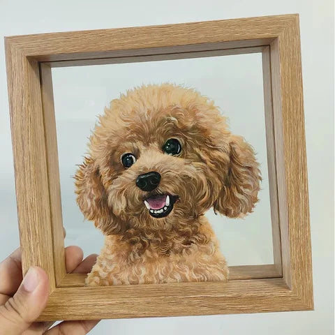 Handheld light-wood frame with brown curly dog against plain background.